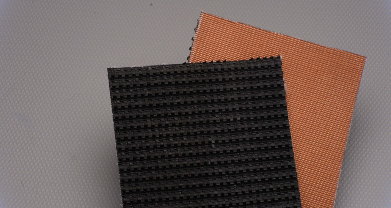 Rubber conveyor belt showing both front and back sides. Front side features diamond top texture in black, and back side is bare in brown, with a thickness of 9/32 inch.