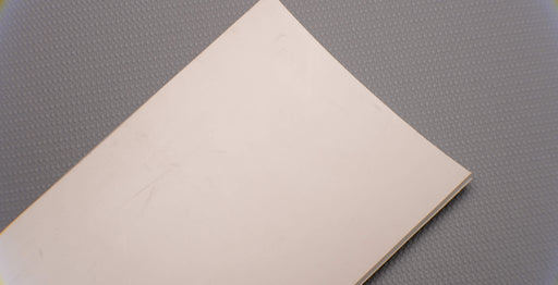 Front view of rubber conveyor belt with smooth white surface, 3/16 inch thickness, durometer 60, tensile strength of 700 psi, and elongation of 300%.