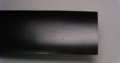 Top side view of rubber conveyor belt with smooth black surface, 1/4 inch thickness, durometer 70, and tensile strength of 500 psi.