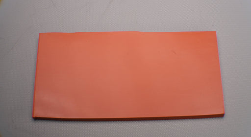 Back view of silicone rubber conveyor belt with smooth red bottom surface, 1/2 inch thickness, and temperature range of -67 to +450°F.