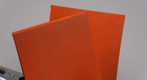 Front and back view of silicone rubber conveyor belt with smooth red surfaces, 1/4 inch thickness, tensile strength of 130-150 psi, and elongation of 200-280%.