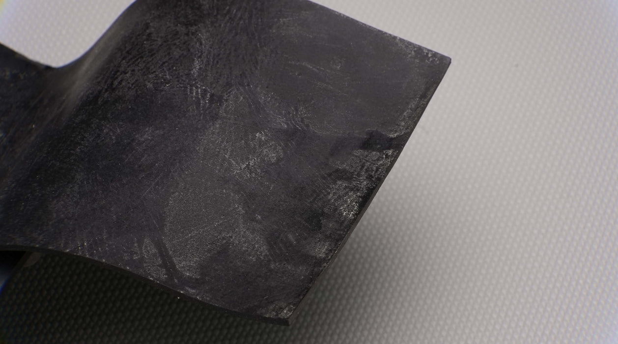 MOR rubber conveyor belt showing materials. The belt is black on both the top and bottom, with a thickness of 3/4 inch, a durometer of 50, tensile strength of 1000 psi, elongation of 400%, and suitable for temperatures from -20F to +170F.