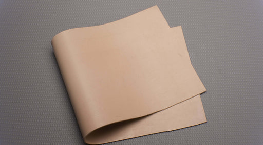 Top and bottom view of PUREGUM tan rubber conveyor belt showing the tan rubber material, 1/16" thickness, with tan top and bottom colors. Includes details on durometer, tensile strength, elongation, and temperature range.