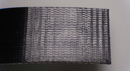 PVC conveyor belt showing the back side. The belt is black with a fabric bottom, 4.5mm thick, made of 1 interwoven layer, with a strength of 28nm elongation. The top side is smooth, and the bottom side is fabric.