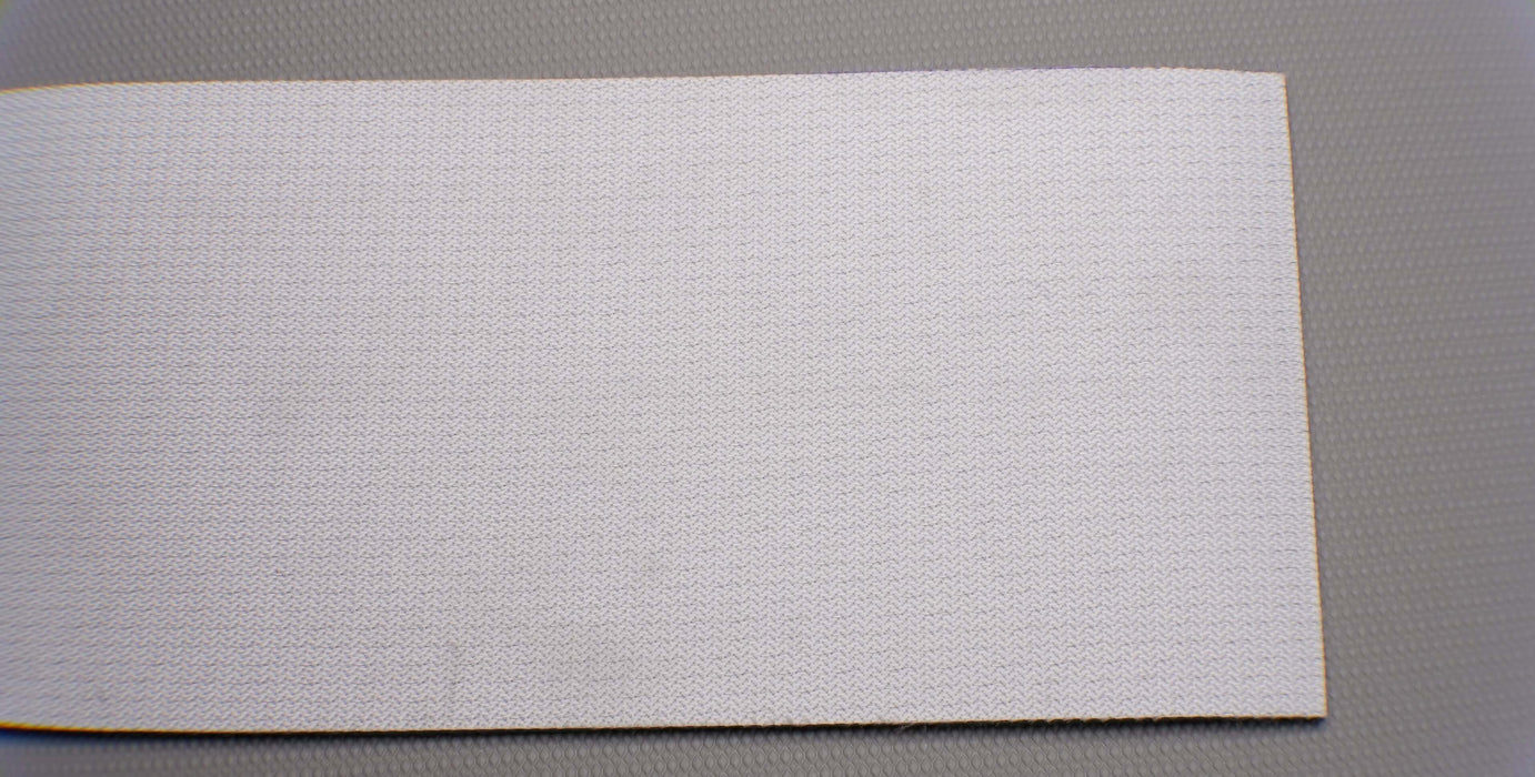 Back side of PVC conveyor belt with white fabric bottom. The belt is 4.5mm thick with 2 layers of monofilament fabric and a strength of 1% elongation at 8nm.