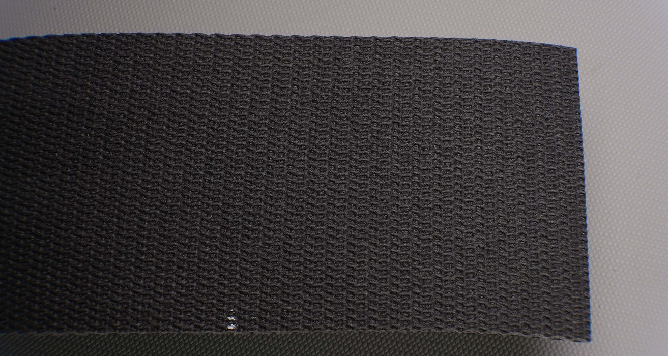 Front side of PVC conveyor belt featuring black fabric top. The belt is 3.5mm thick, with 1 layer of interwoven fabric and a strength of 1% elongation at 28nm.