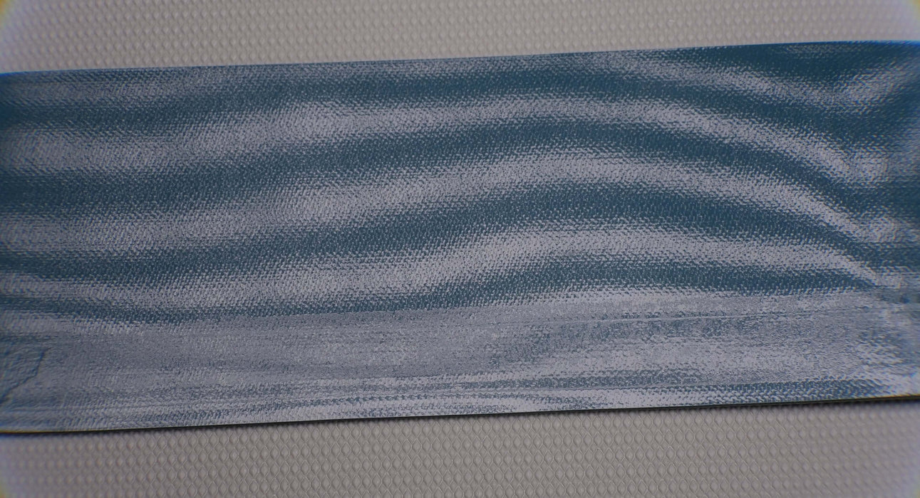 Front side of PVC conveyor belt with a green smooth top. The belt is 2mm thick, composed of 2 monofilament fabric layers with a strength of 1% elongation at 8nm.