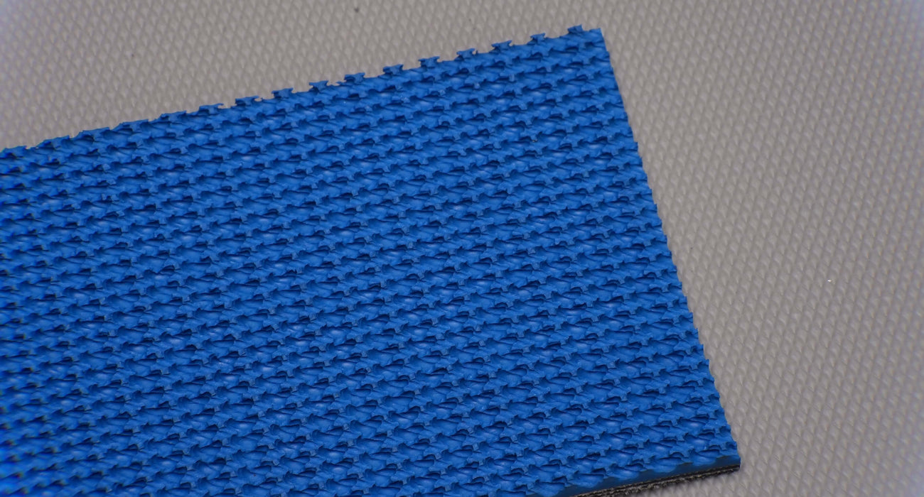 RBR conveyor belt showing the front side. The belt has a blue rough top with a black fabric bottom, 7.1mm thick, made of 3 layers, with a strength of 42nm elongation. The top color is blue, and the bottom color is black.