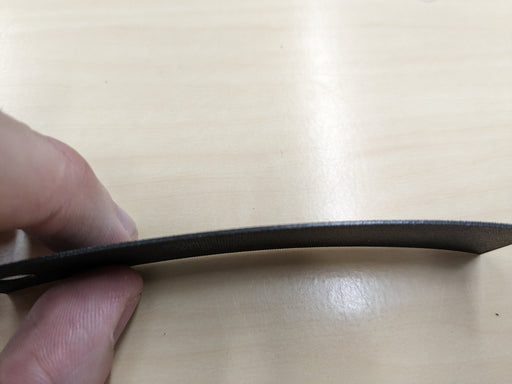 Side view of the NC conveyor belt on a sample, highlighting the 0.8mm thickness and green fabric top.