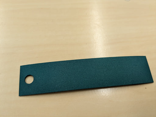 Front/Top view of the NC conveyor belt on a sample, showcasing the green fabric top and black fabric bottom with 0.8mm thickness.