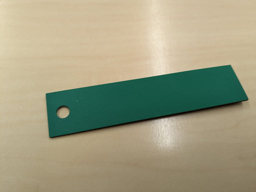 "NC nylon conveyor belt with green diamond surfacing top and black smooth bottom, 1mm thickness.