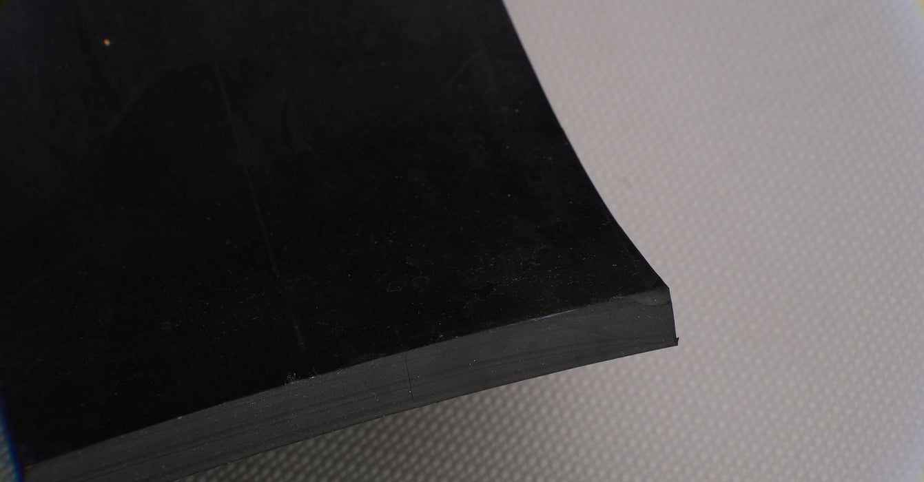 Alternate back side view of MOR rubber conveyor belt with 1/2 inch thickness, black color, top and bottom rubber.