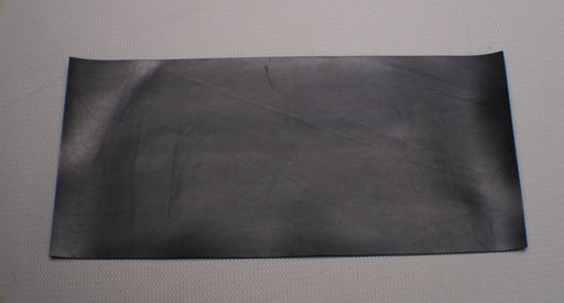 View of MOR rubber conveyor belt showing black bottom surface, 1/16" thickness.