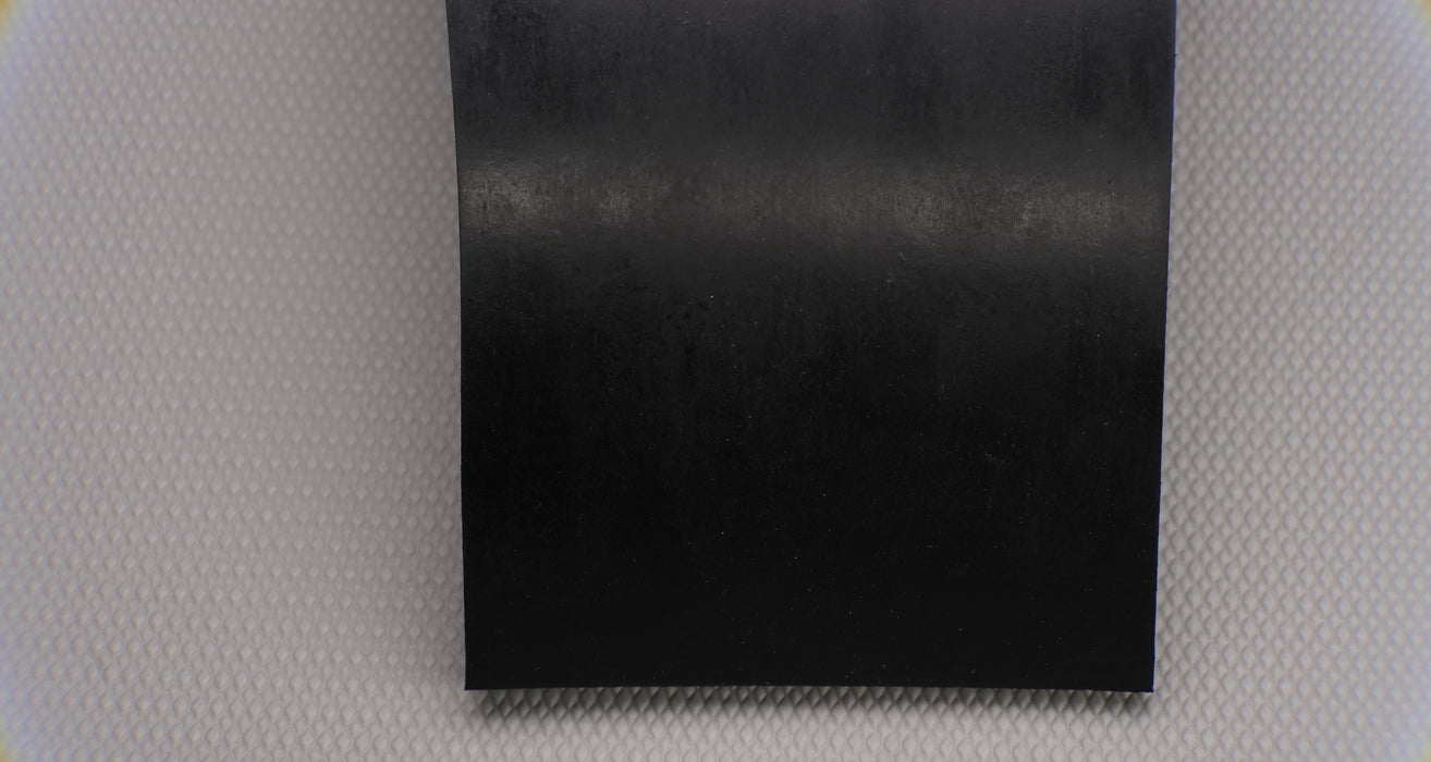 Full view of MOR rubber conveyor belt displaying black top and bottom, 1/16" thickness.