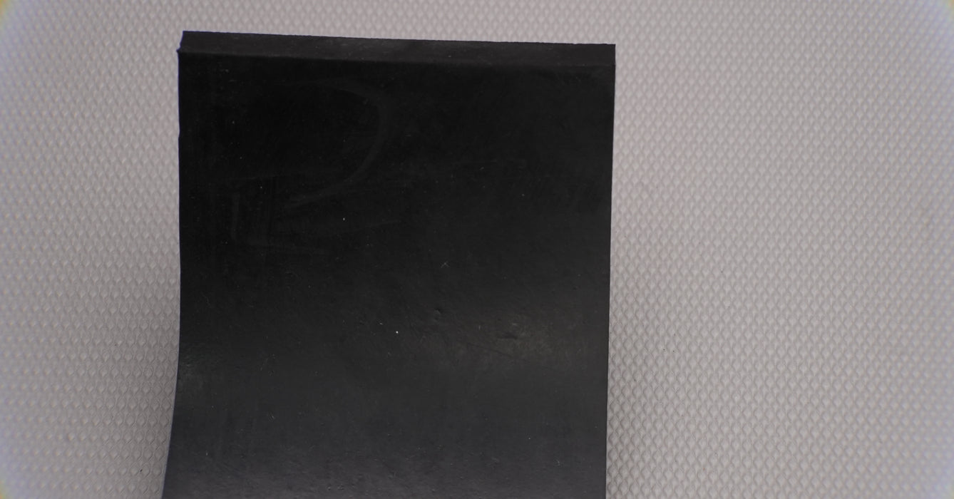 Top and bottom views of MOR rubber conveyor belt showing black surfaces, 1/16" thickness