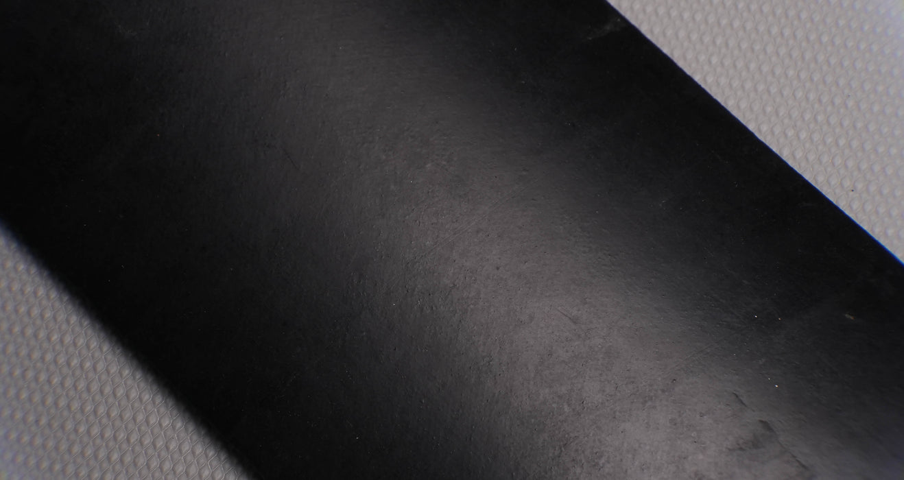 Front side view of MOR rubber conveyor belt with 1/4 inch thickness, black color, top and bottom rubber.