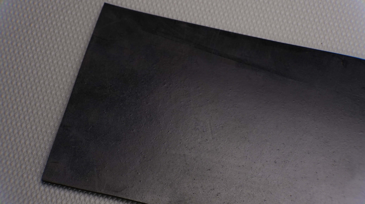 Front side view of MOR rubber conveyor belt with 1/8 inch thickness, black color, top and bottom rubber.





