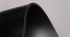 View showing the top and bottom sides and thickness of MOR rubber conveyor belt with 1/4 inch thickness, black color, top and bottom rubber.