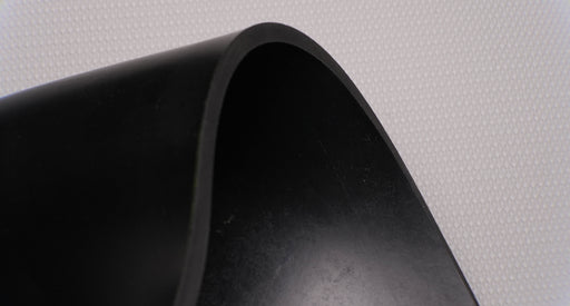 View showing the top and bottom sides and thickness of MOR rubber conveyor belt with 1/4 inch thickness, black color, top and bottom rubber.