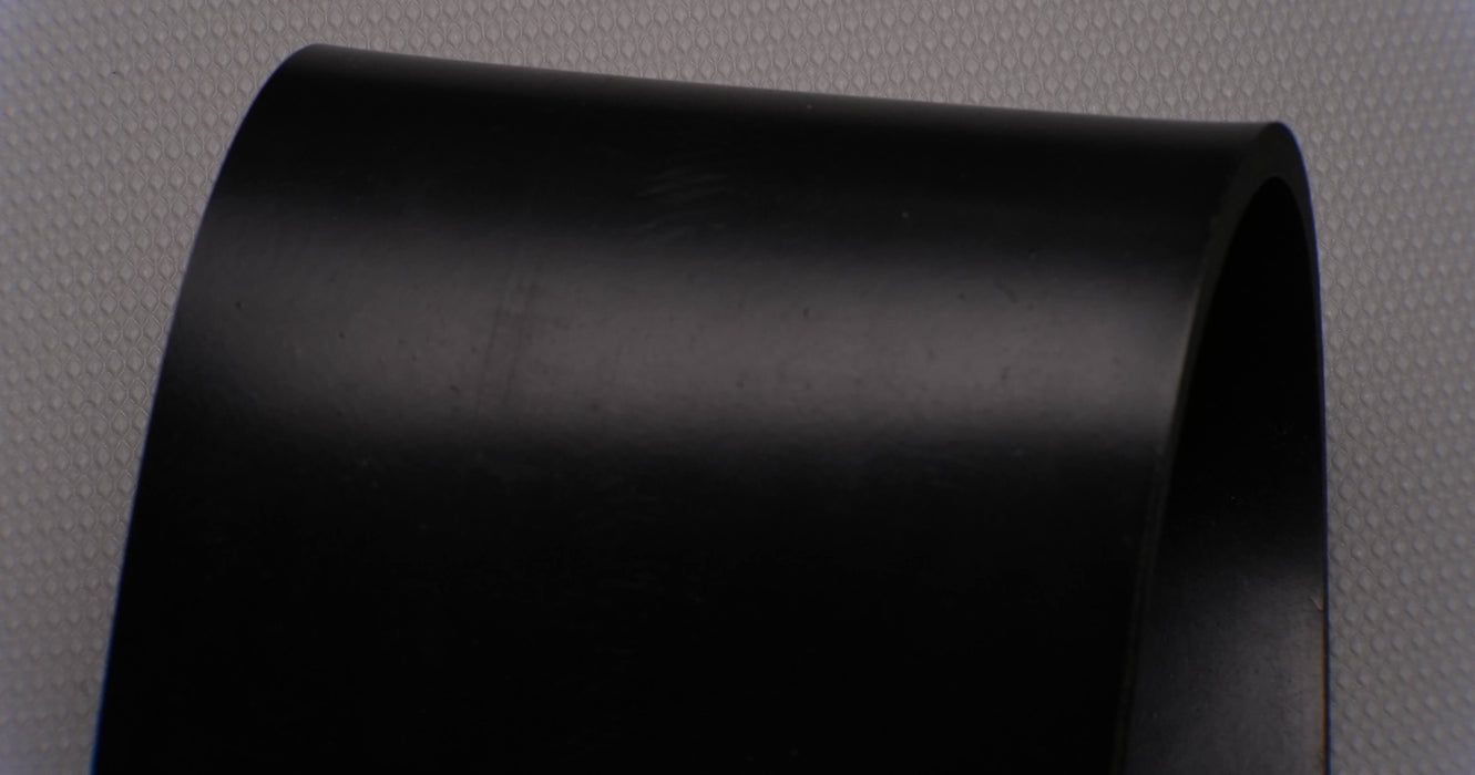 View showing the top and bottom sides of MOR rubber conveyor belt with 1/4 inch thickness, black color, top and bottom rubber.