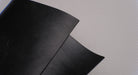 View of MOR rubber conveyor belt showing black top surface, 1/16" thickness.