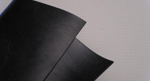 View of MOR rubber conveyor belt showing black top surface, 1/16" thickness.