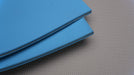 NC conveyor belt showing both front and back sides, featuring blue diamond surfacing and 6mm thickness.







