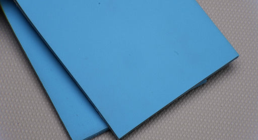 NC conveyor belt showing both front and back sides with diamond surfacing, blue color, and 6mm thickness.