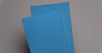 Front and back view of NC conveyor belt showing diamond surfacing in blue, made from nylon fabric with 4mm thickness.