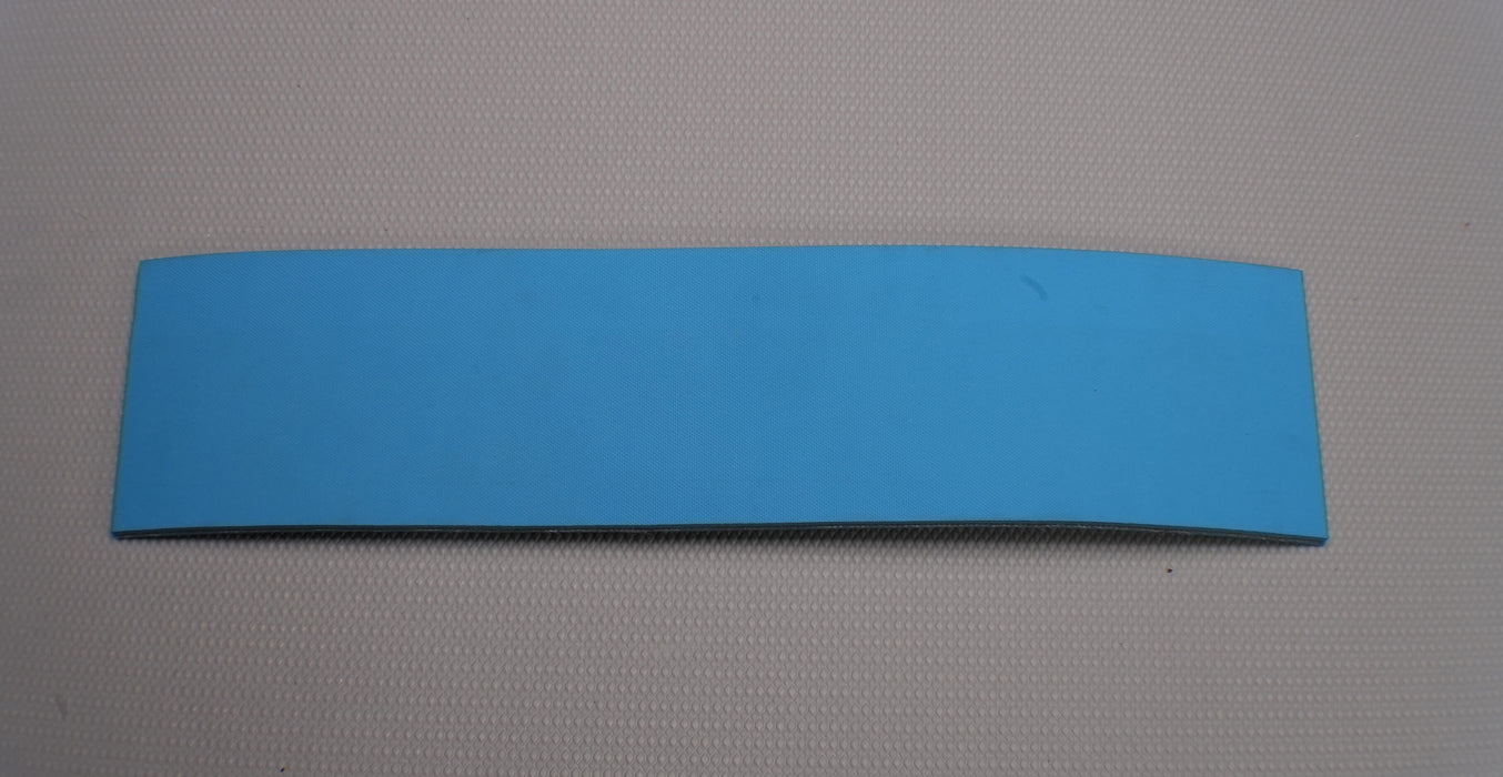 Front view of NC conveyor belt showing diamond surfacing in blue, made from nylon fabric.