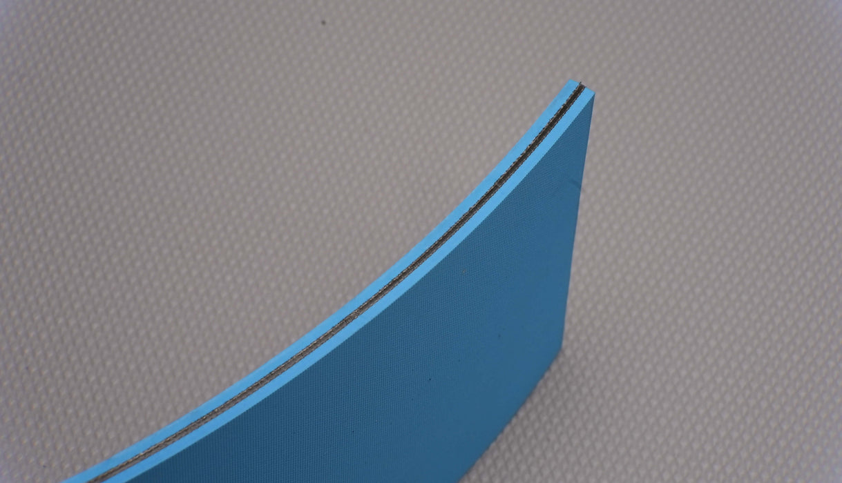 Side view of NC conveyor belt showing 6mm thickness and back side with diamond surfacing in blue color.