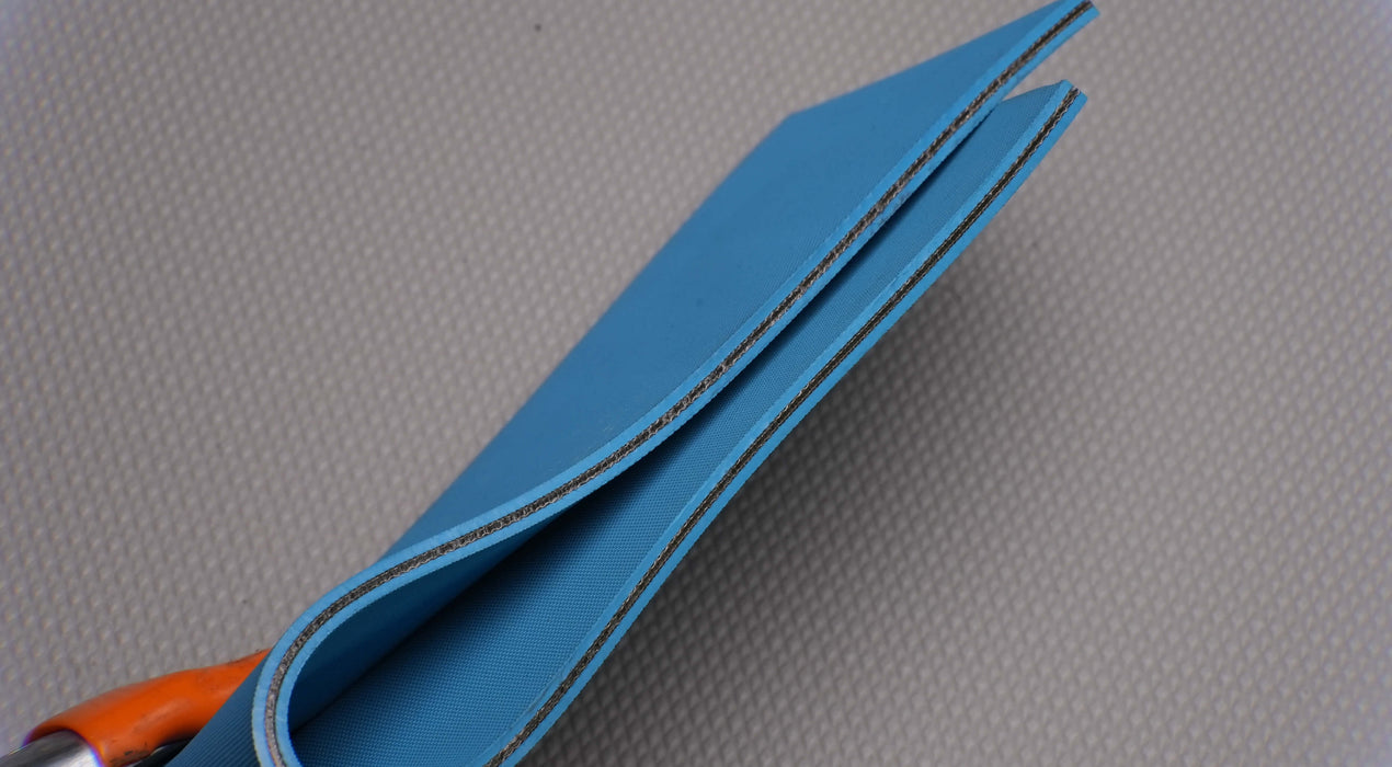 Side view of NC conveyor belt with diamond surfacing, blue color, and 4mm thickness, made from nylon fabric with 3.8nm strength.