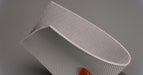 Side view of natural conveyor belt showing 0.25 inch thickness with white meat-cleat top and friction side bottom.






