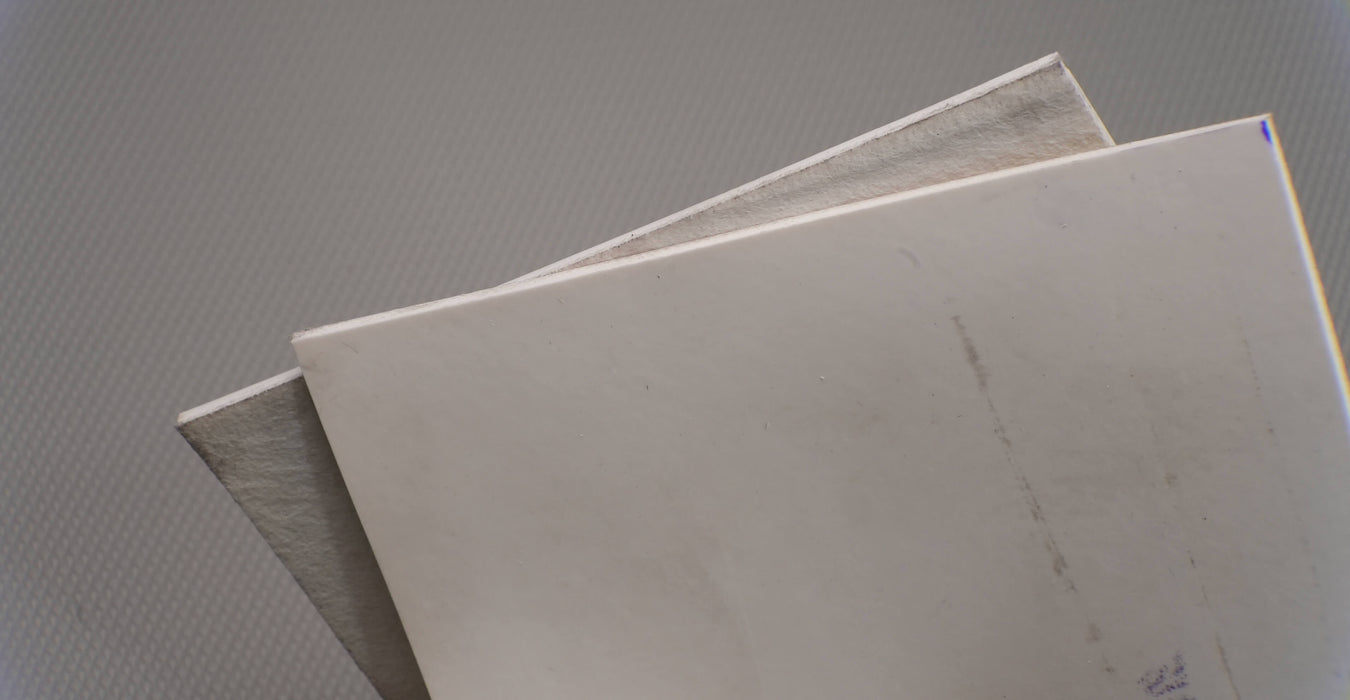 Top and bottom view of natural conveyor belt with meat-cleat top and friction side bottom, both in white, 0.25 inch thickness.