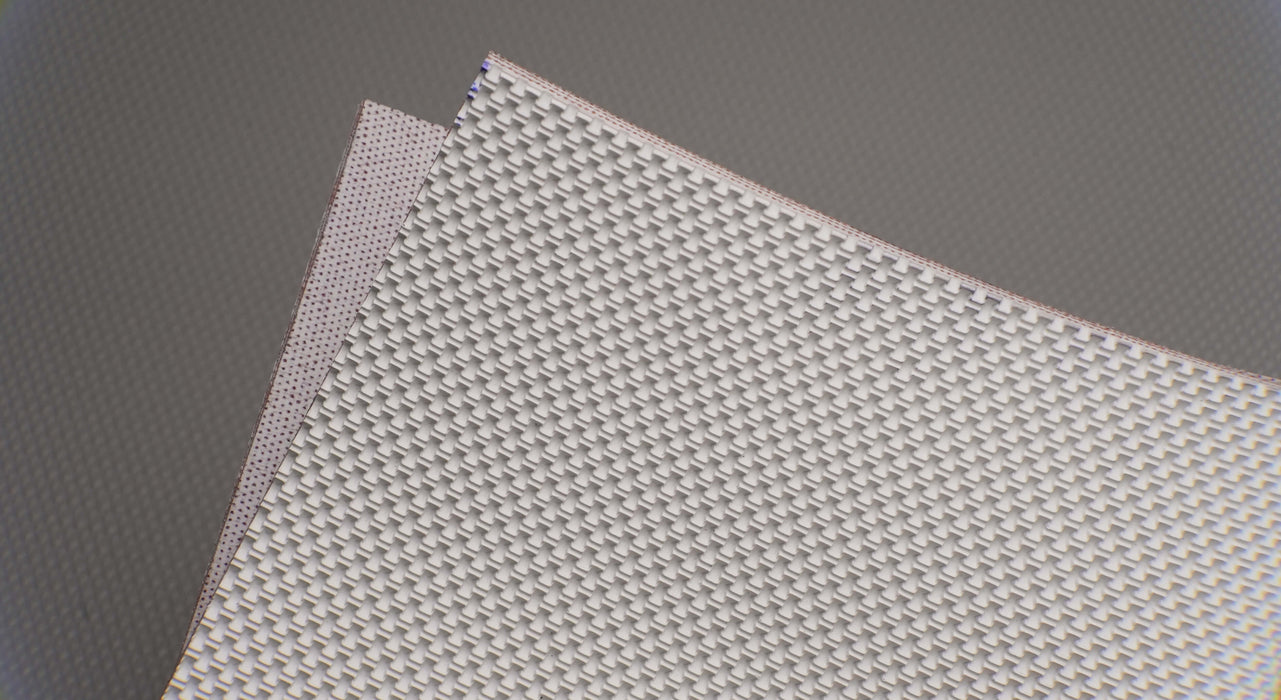 Top and bottom view of natural conveyor belt with meat-cleat top and friction side bottom, both in white, 0.25 inch thickness.