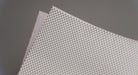 Top and bottom view of natural conveyor belt with meat-cleat top and friction side bottom, both in white, 0.25 inch thickness.
