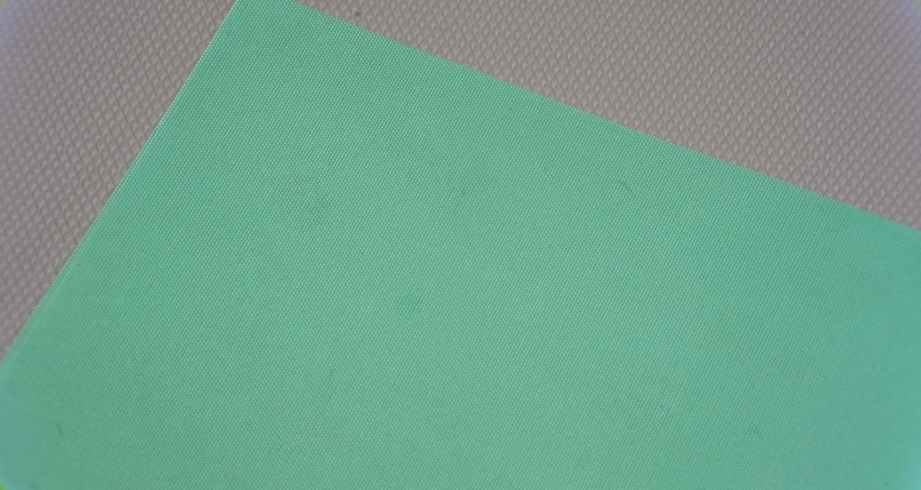 Bottom view of PU conveyor belt showing green impregnated surface, 0.40mm thickness