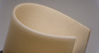 Side view of PU conveyor belt with smooth clear top, fabric bottom in white, and 4mm thickness, made with monofilament fabric and 10nm strength.