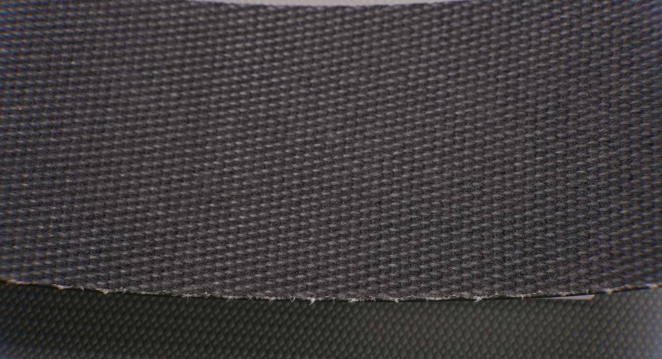 Back view of PVC conveyor belt with brush bottom, black color, and 9/64 inch thickness, made from interwoven fabric with 0.073 lbs/in strength.