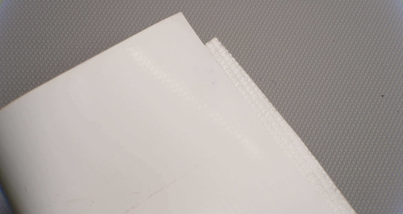 Back view of PVC conveyor belt with fabric bottom, white color, and 6mm thickness, made from interwoven fabric with 28nm strength.






