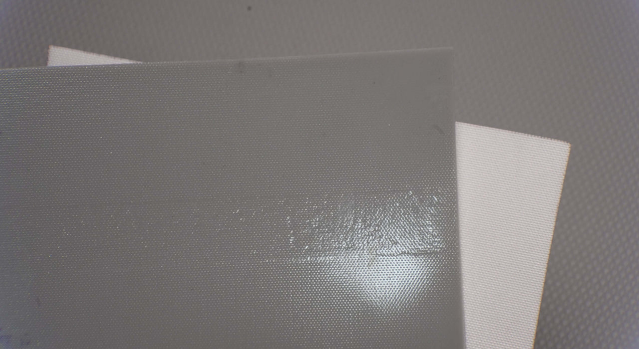 Detail of polyfabric bottom on PVC 2-layer conveyor belt.