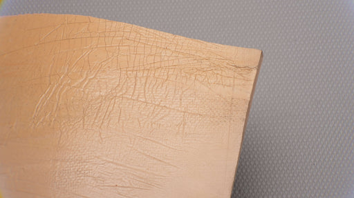 First back view of Puregum tan rubber with 1/4 inch thickness, tan color, 40 durometer, 3000 psi tensile strength, and 700% elongation.

