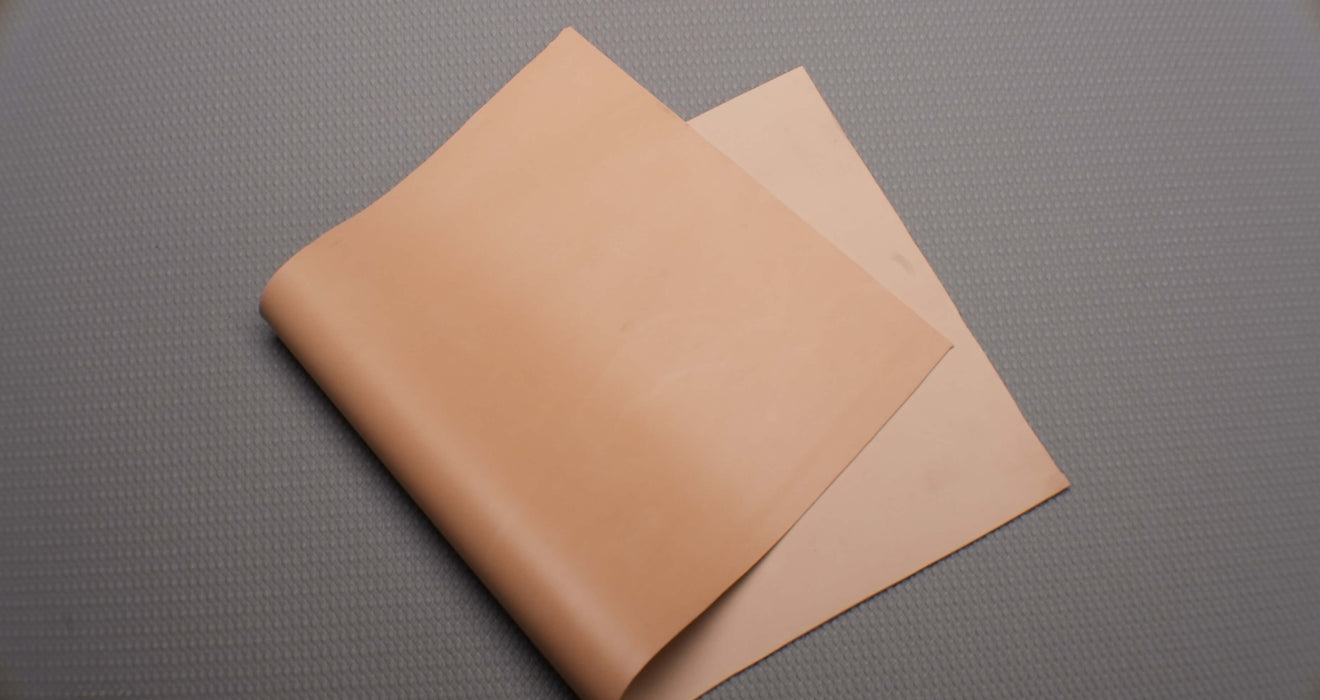  Second front and back view of Puregum tan rubber with 1/32 inch thickness, tan color, 40 durometer, 3000 psi tensile strength, and 700% elongation.