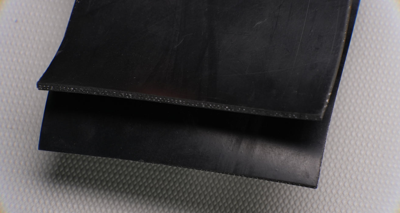 1/8 inch thick rubber conveyor belt with black layers.