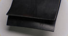 1/8 inch thick rubber conveyor belt with black layers.