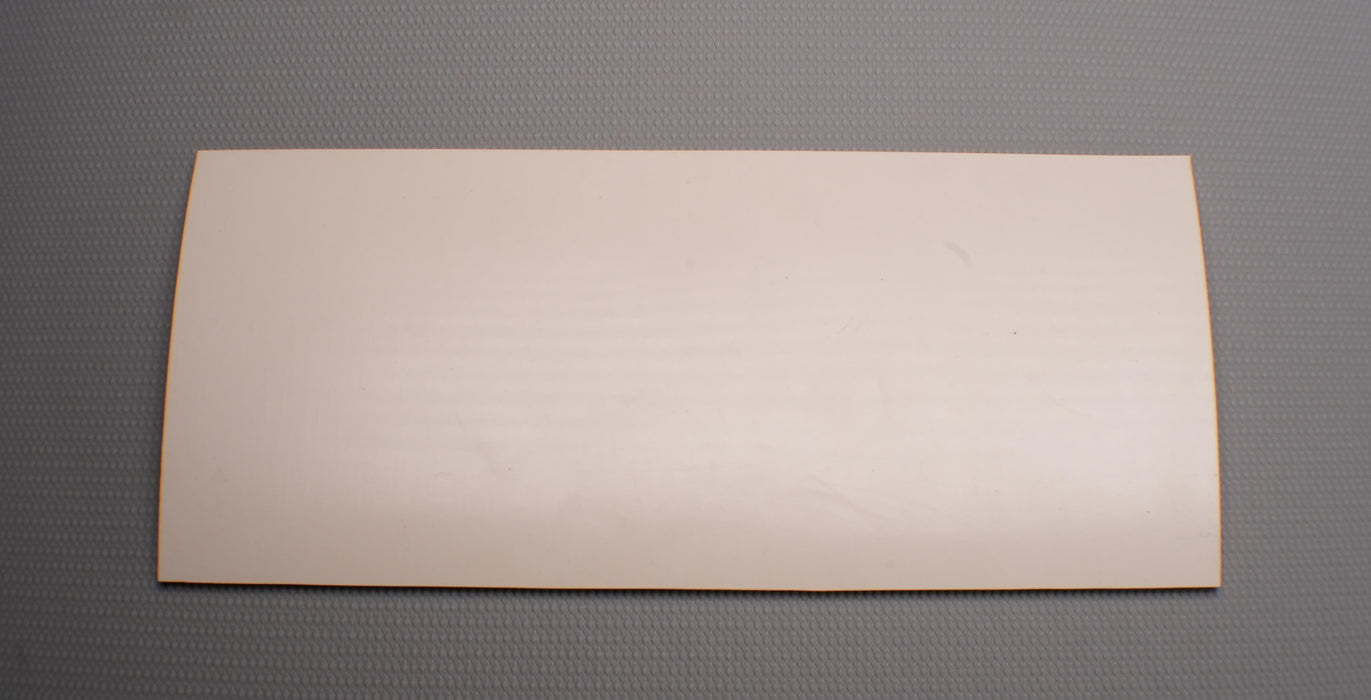 Back view of rubber conveyor belt with smooth white surface, 3/16 inch thickness, and a temperature range of -22°F to +176°F.