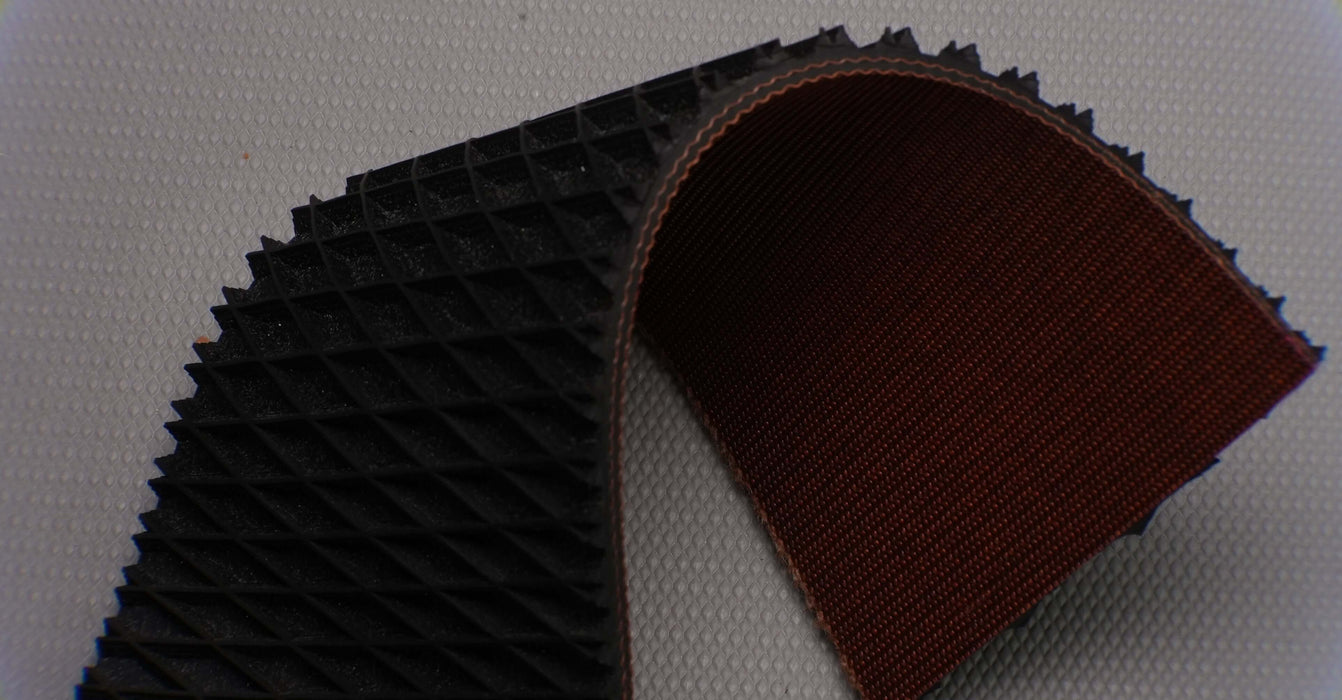 Black top surface of rubber 2-layer conveyor belt.