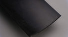 Bottom side view of rubber conveyor belt with smooth black surface, 1/4 inch thickness, and a temperature range of -10°F to +190°F.