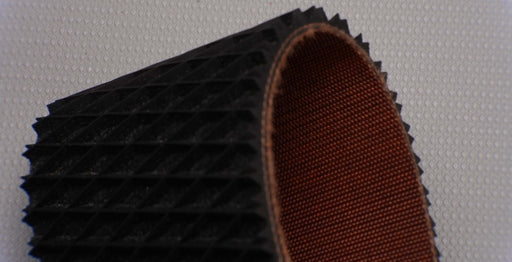 Diamond texture on rubber 2-layer polyester conveyor belt.