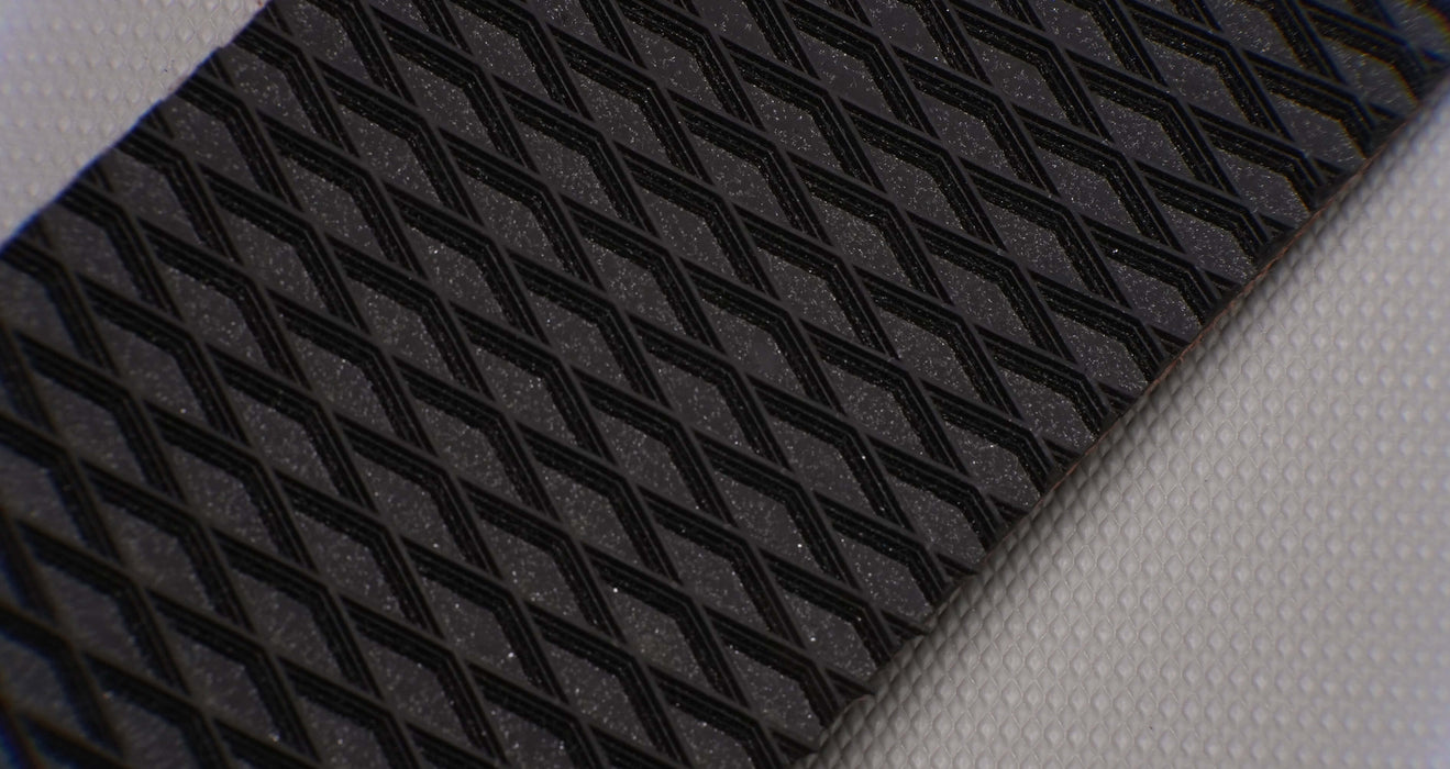 Full length view of rubber conveyor belt with diamond top